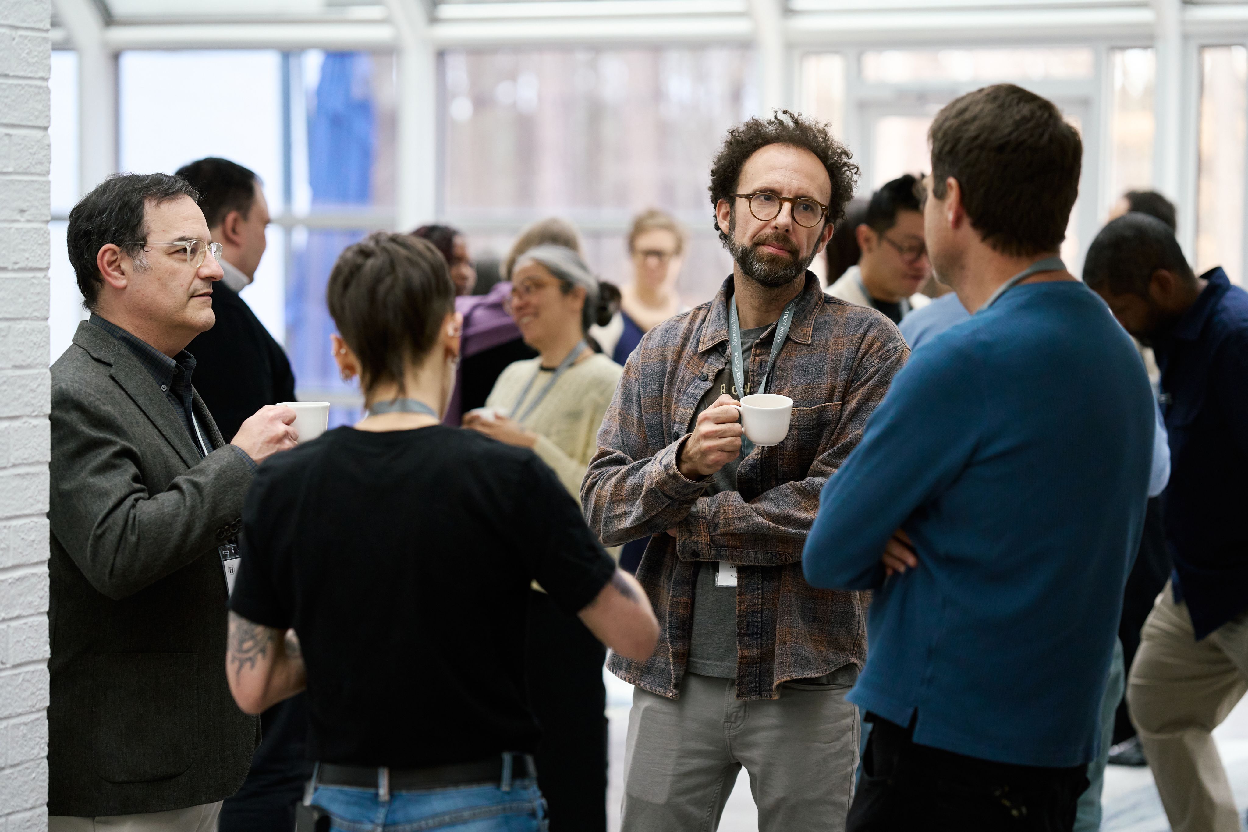 Fellows and friends talking over tea