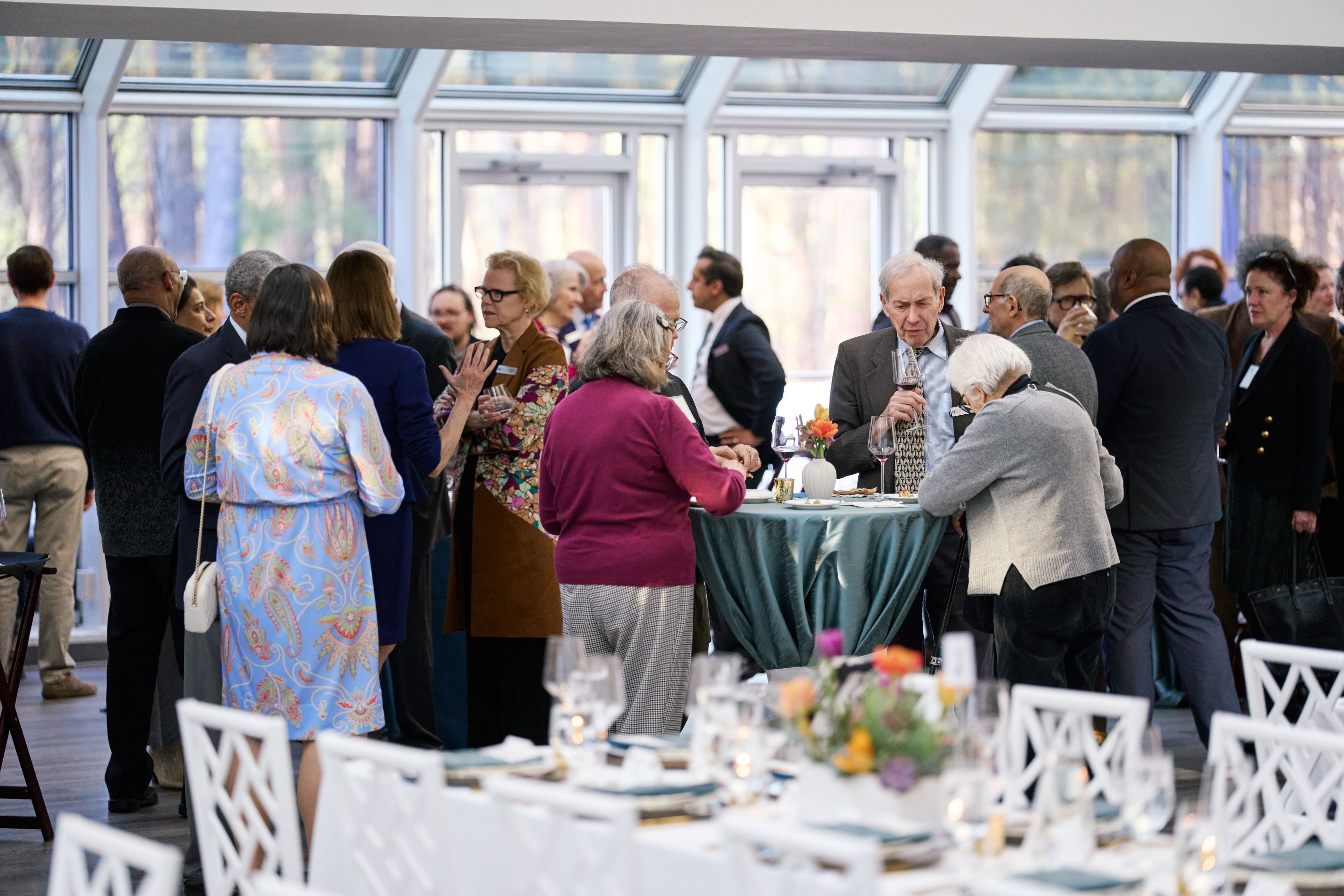Installation attendees enjoy cocktail hour