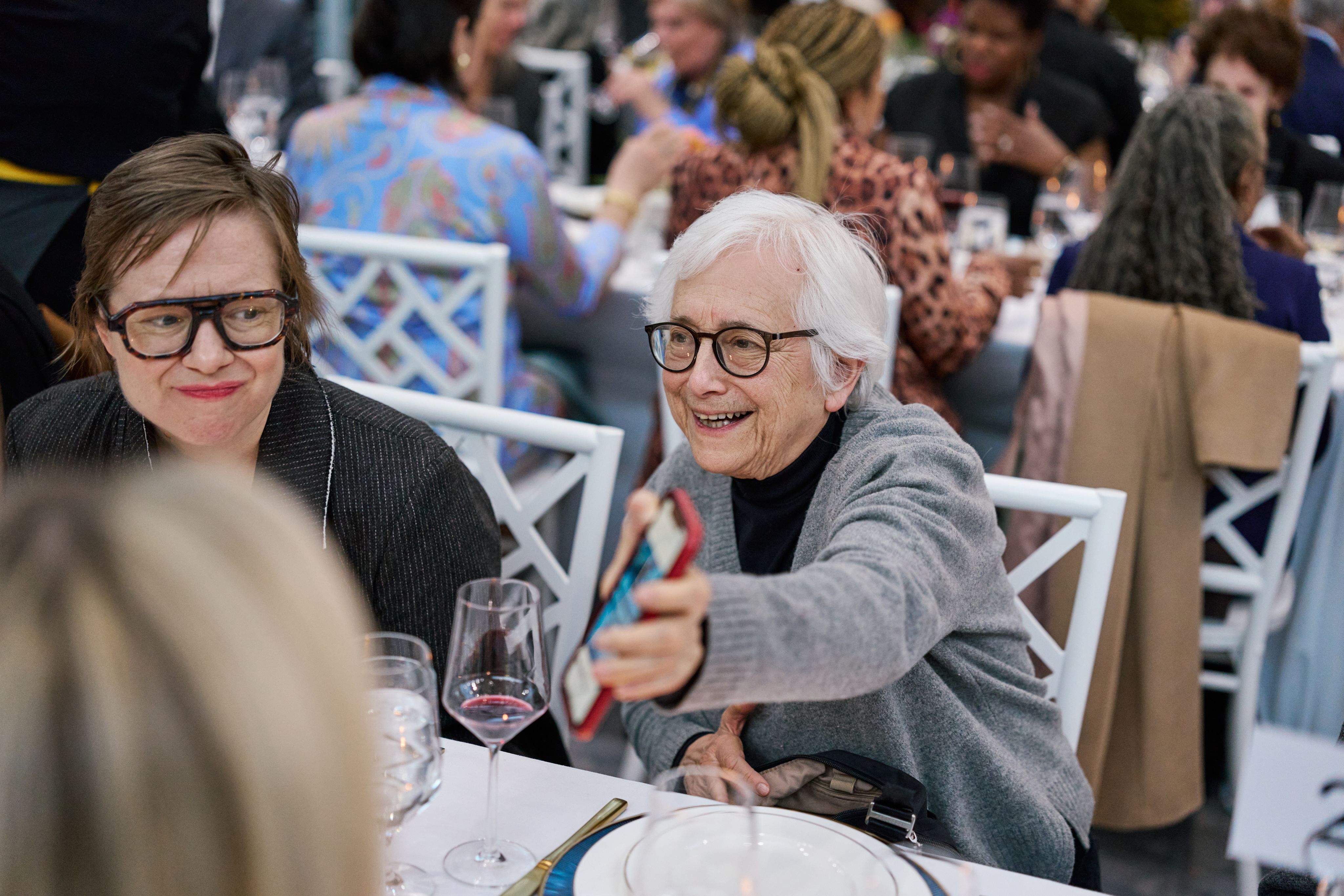 Installation attendees enjoy conversation during dinner