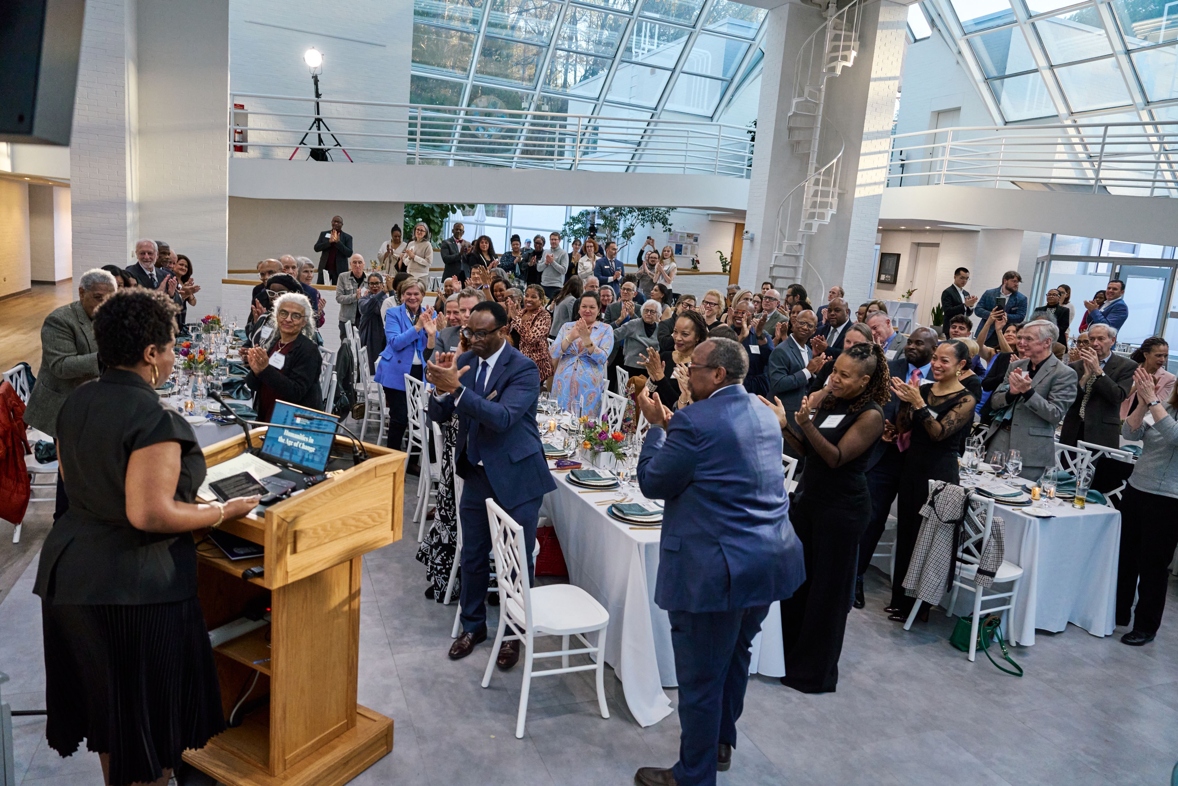 Blair LM Kelley receives applause following her installation address