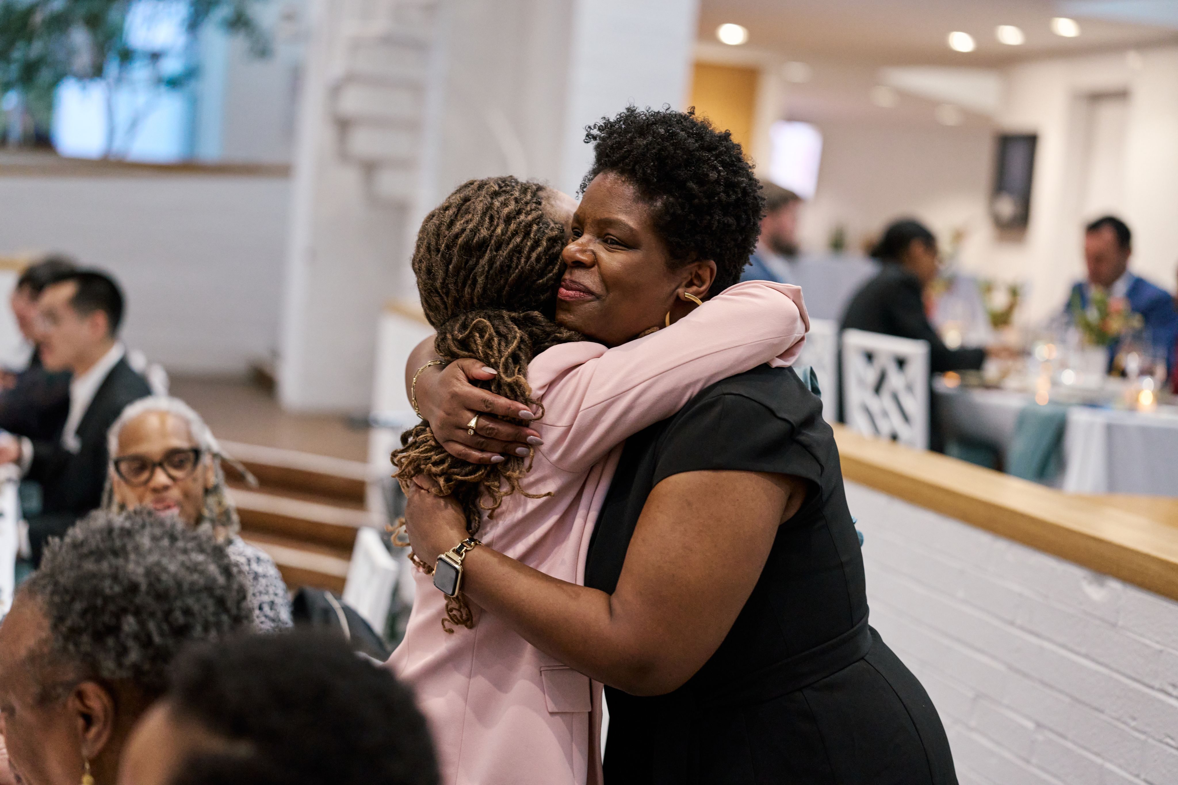 Blair LM Kelley hugs attendee